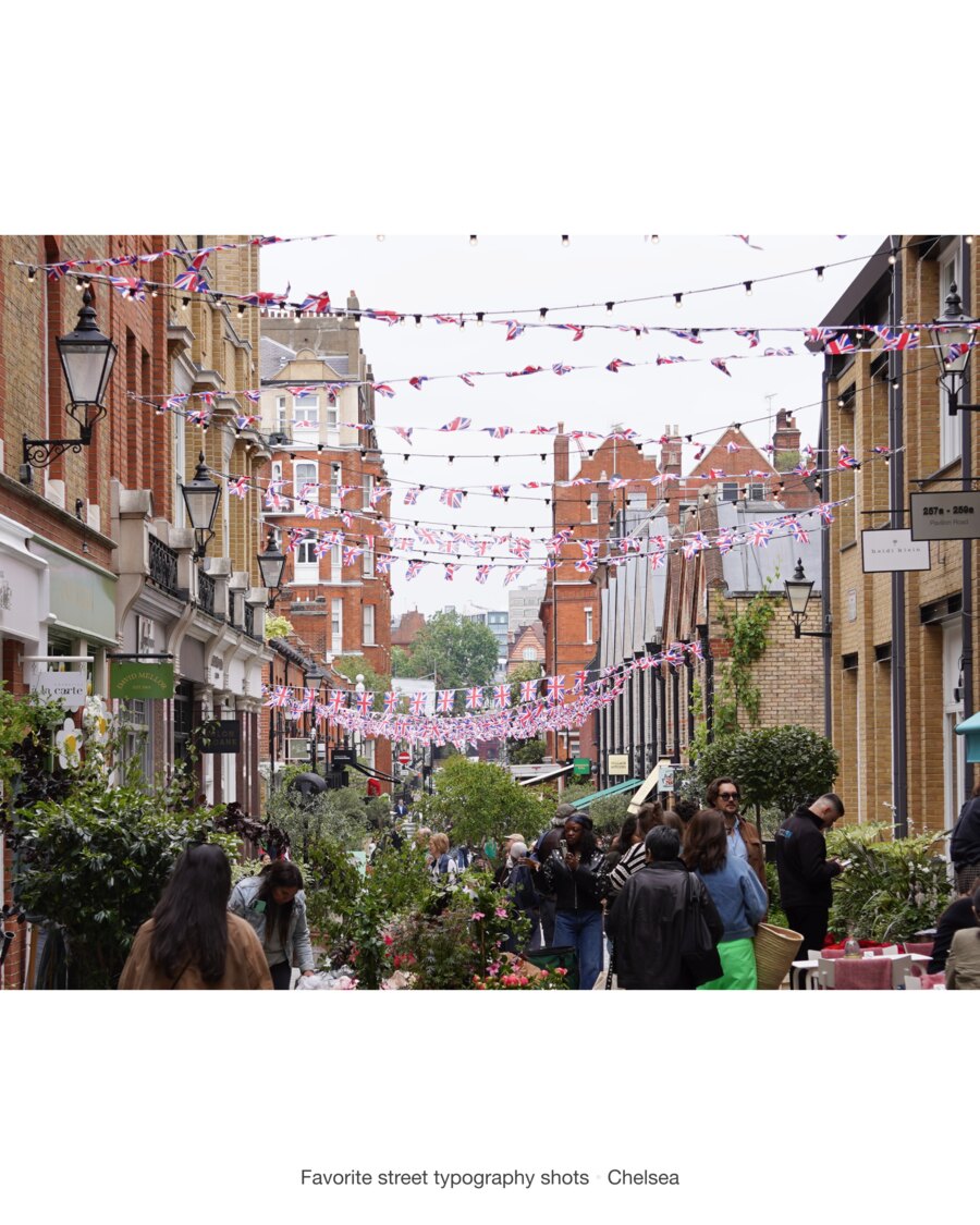 Pavilion Road strung with rows of Union Jack bunting between brick terraces, shopfronts for David Mellor, Heidi Klein and the Village Butcher below, and people among the flower stalls.